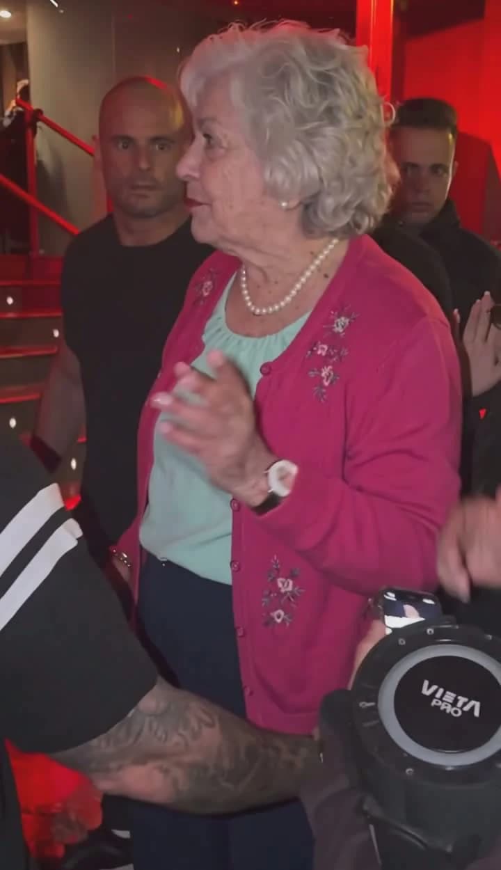Frame from the completed grandmother freestyle video, with her pink cardigan and mint blouse in the source scene